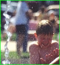 Nicolai is playing in the fountain