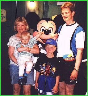 Daniel is squeezing Mickeys nose